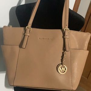 Michael Kors Women's Jet Set Saffiano Top-Zip Tote color is dark tan